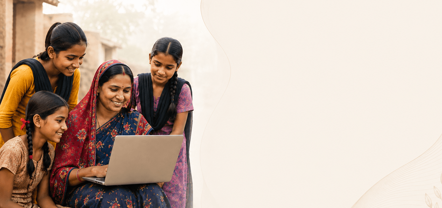 Women and girls learning together on a laptop